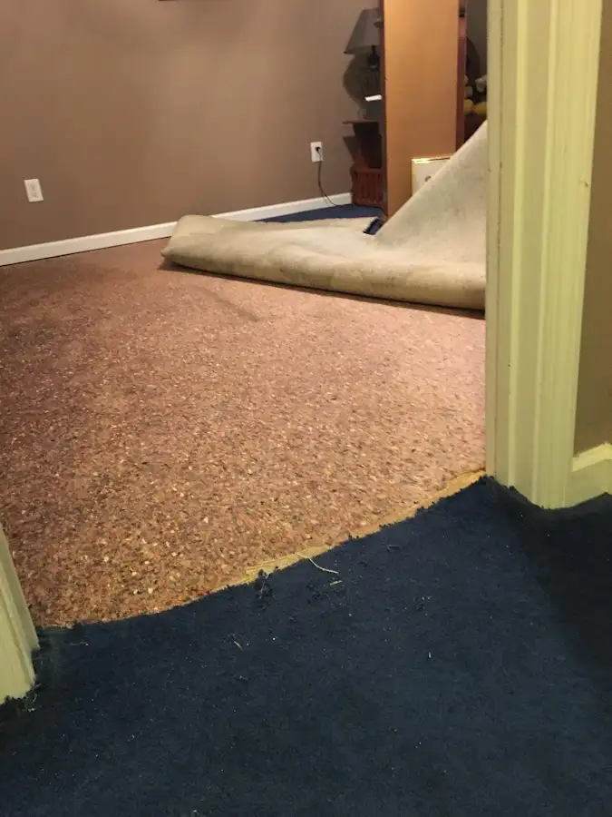 Carpet pad removal revealing water damage during Drying & Dehumidification in Linda
